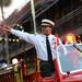 A member of the Tampa Fire Department throws beads during the Outback Bowl New Year's eve parade in Ybor City, Fla. on Monday night. Melanie Maxwell I AnnArbor.com